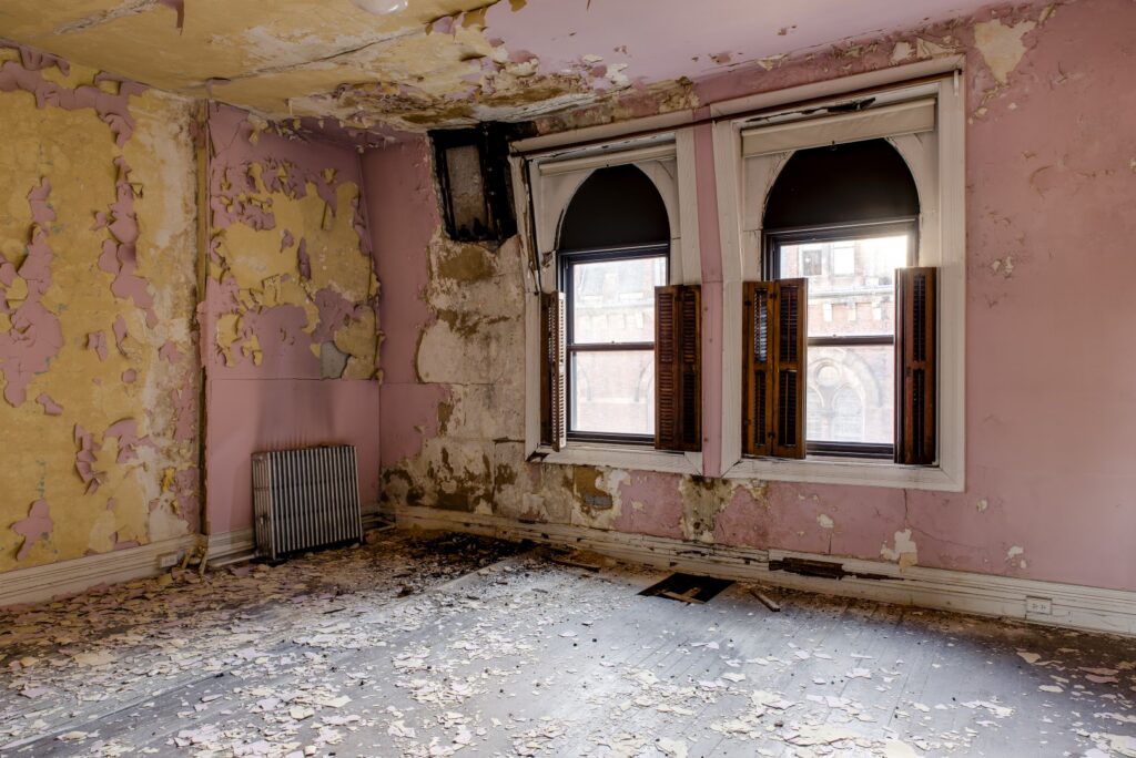 an interior view of a pink painted room with window