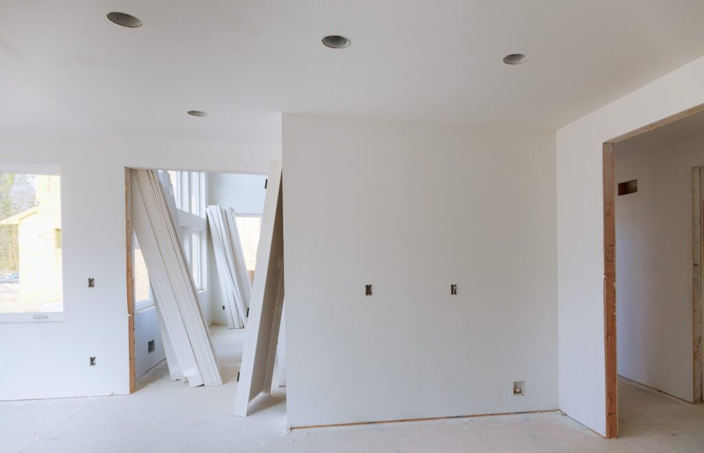 Construction remodeling home wooden trim board on with circular saw.